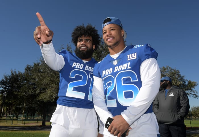 Jan 25, 2019; Kissimmee, FL, USA; Dallas Cowboys running back Ezekiel Elliott (26) and New York Giants running back Saquon Barkley (26) pose during NFC practice at ESPN Wide World of Sports Complex.